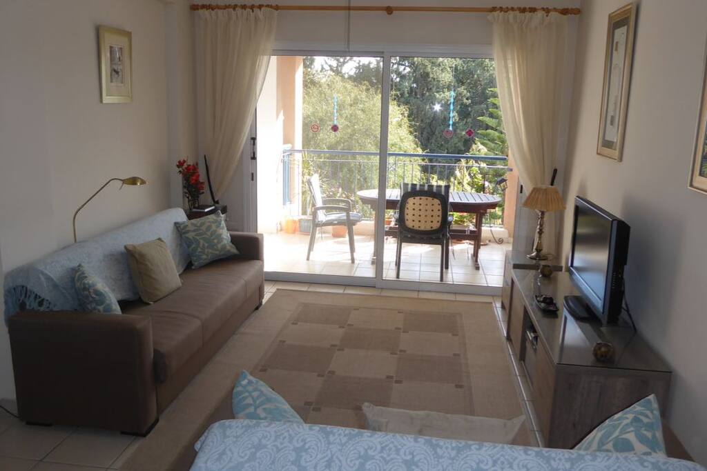 Lounge with patio table on balcony and
view beyond