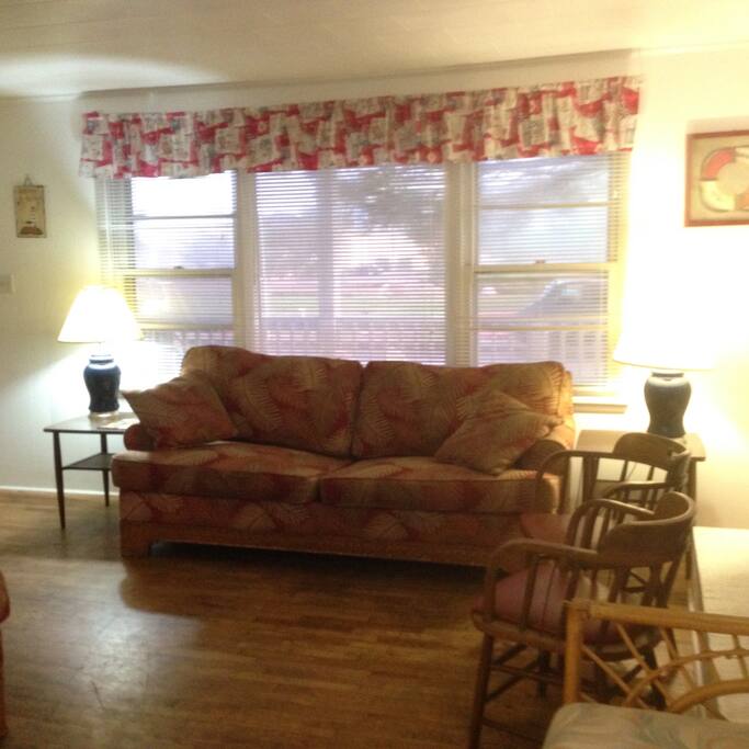 Large picture window and front door to porch.
