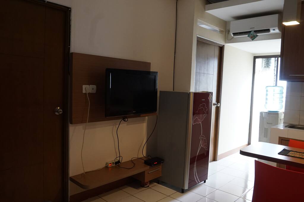 Living Room with Refrigerator, TV and AC