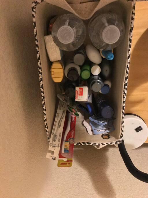 Basket of toiletries and bottles of water provided for my guests.