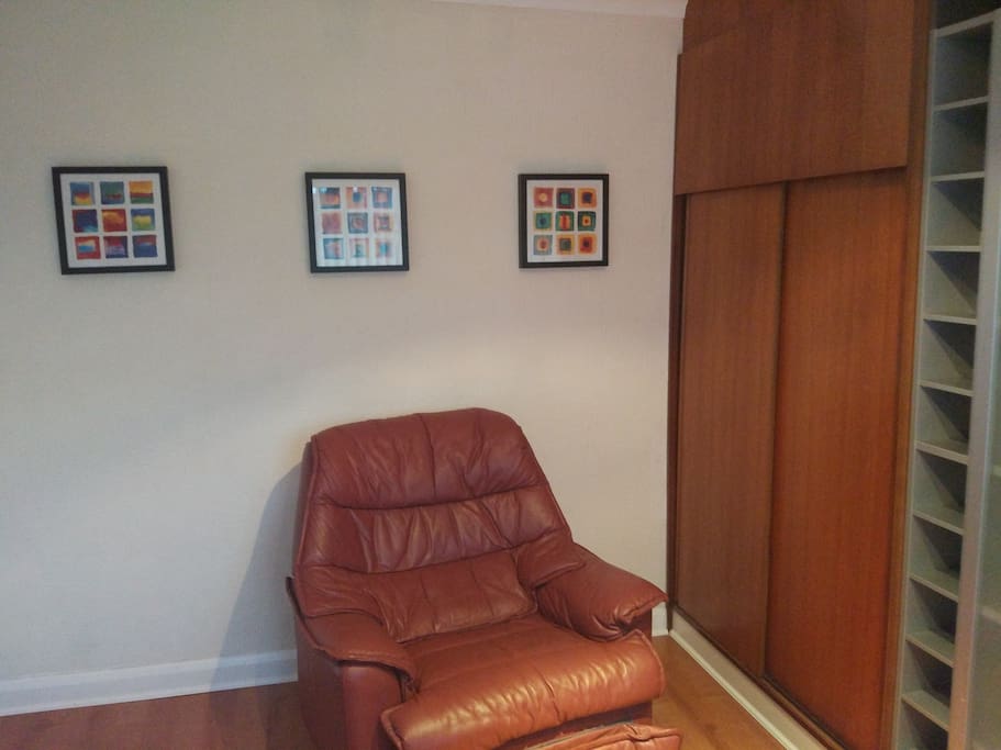 Room 1 - Comfy armchair and spacious wardrobe and shelves
