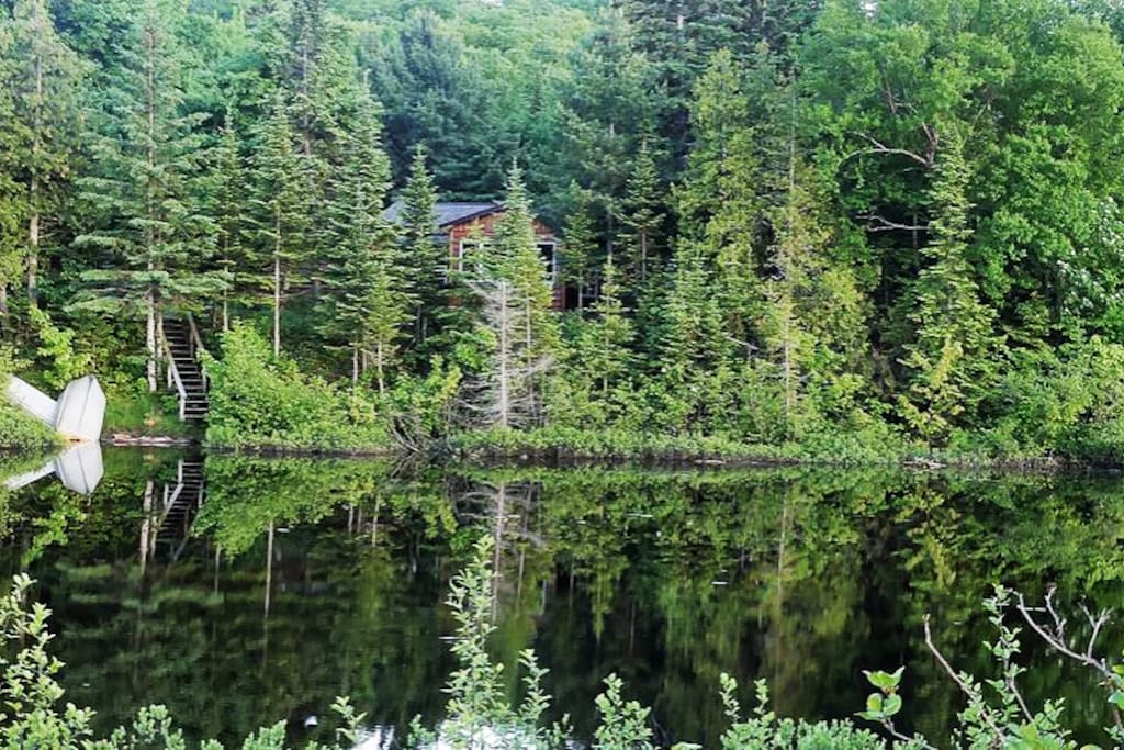 Peace. Cabin and a mirror of water.