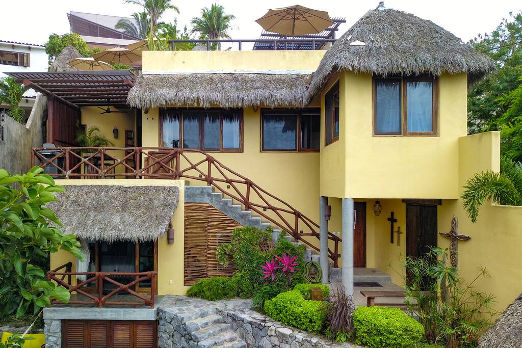 Guest suite on the first level and kitchen, living and dining, deck, 2 bedrooms and bathroom on the second level