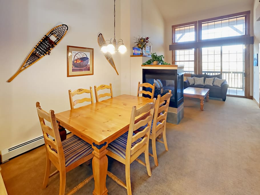 An inviting open floor plan with high ceilings and an abundance of natural light creates a welcoming vibe.