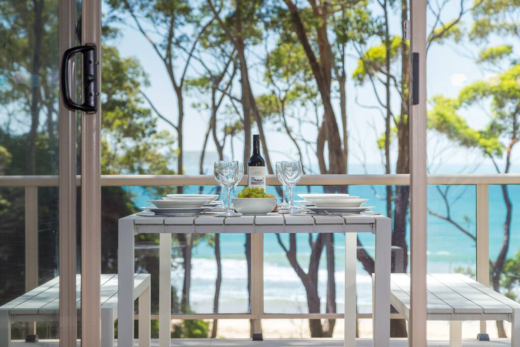 Dining on the balcony overlooking Denhams Beach