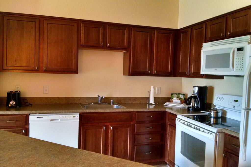 Kitchen-Complete with Refrigerator, Stove, Oven, Dishwasher, Microwave, Dishes, Pots, Pans, etc. Everything needed to prepare your own meals.