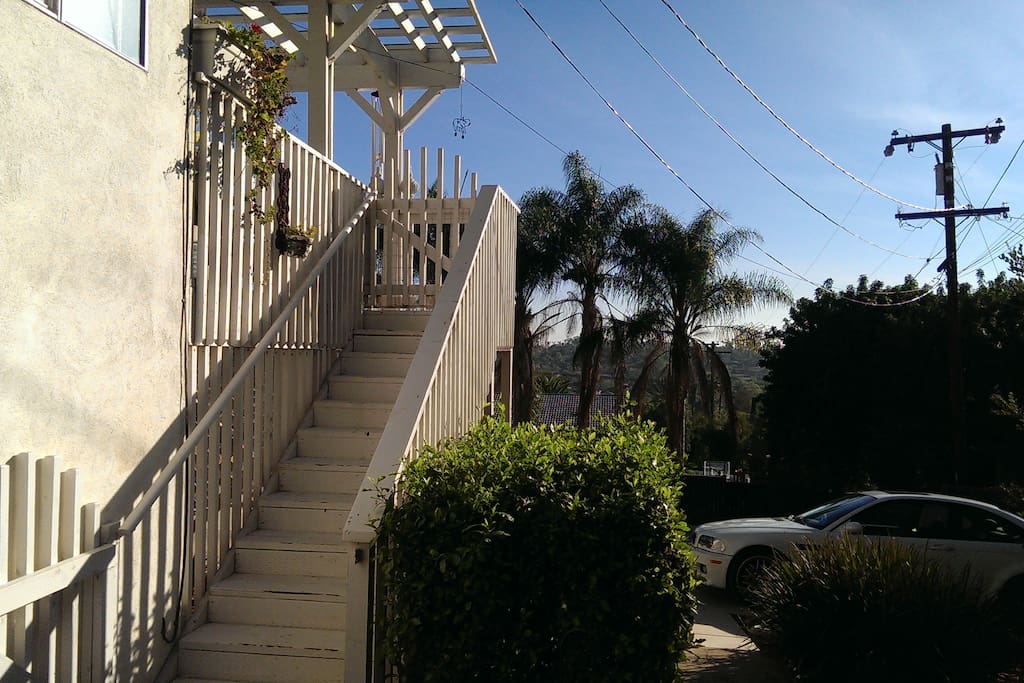 These stairs lead from your off street parking spot to the spacious shared deck that is the entrance to your room.