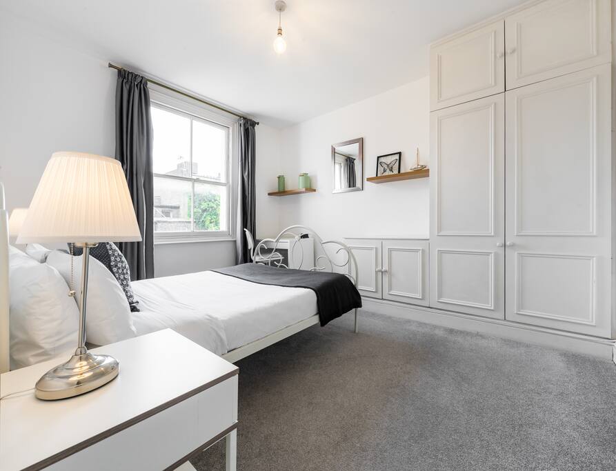 Bright and spacious bedroom with lots of wardrobe space.