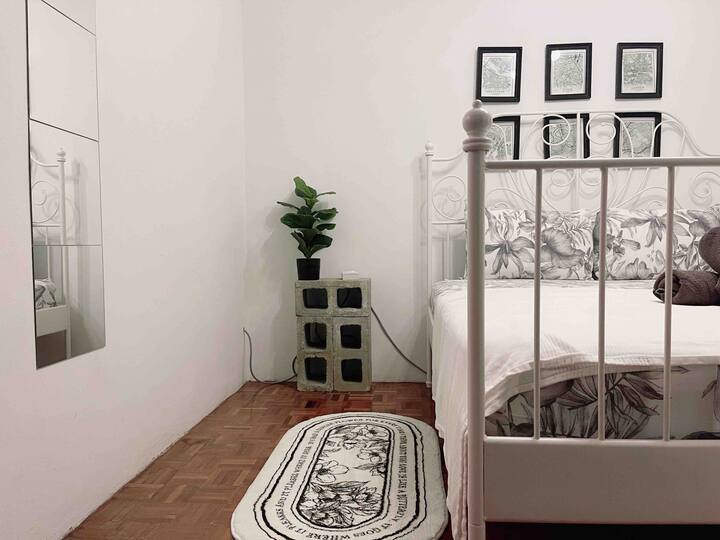 Second room with one queen size IKEA bed frame and mattress. Pillow brand is from Akemi. 