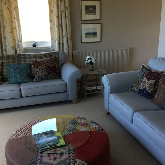 Comfortable sitting room with views of the sea