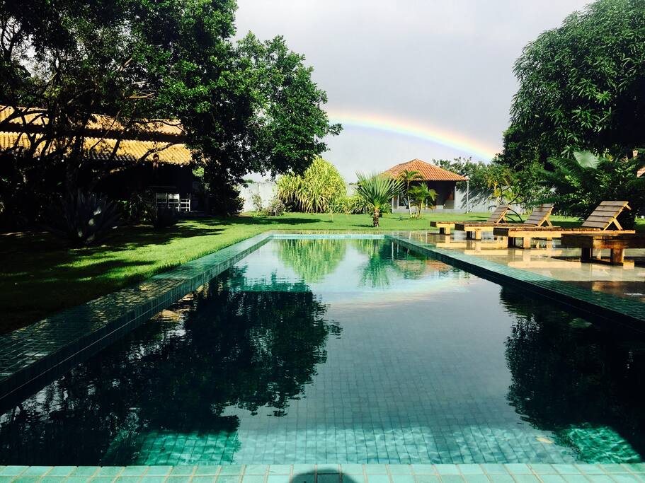 Pool with view of main house and chalet