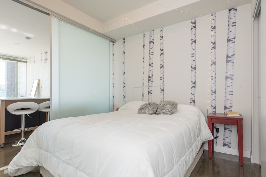 Bedroom with sliding glass walls