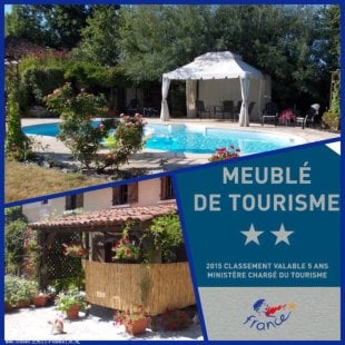 A swimming pool is surrounded by shaded seating areas and a gazebo, providing a relaxing outdoor space. The vibrant greenery of the garden enhances the environment, while a sign indicating the two-star classification as a furnished tourist accommodation is prominently displayed.