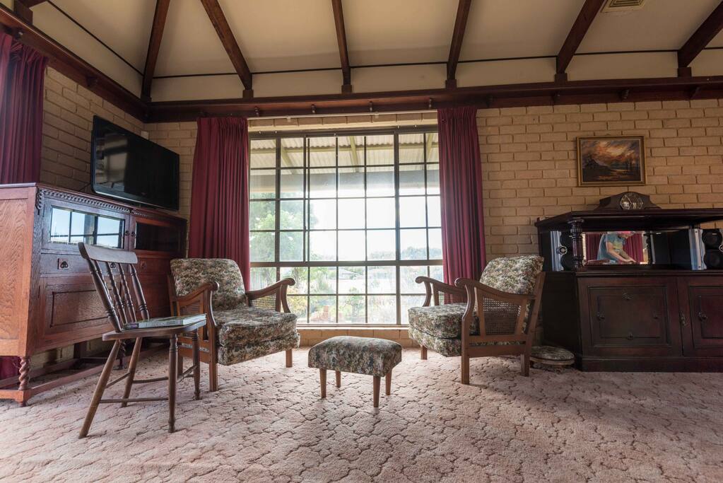 Large living space with couches and single seats. Many a deep conversation has occurred here