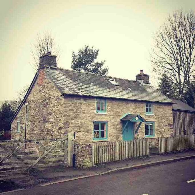The front of the cottage, with your private driveway to the left, and the garden behind.