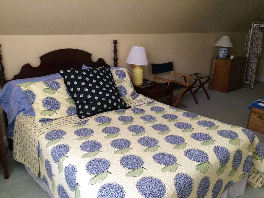 Guest suite includes comfortable queen size bed.
