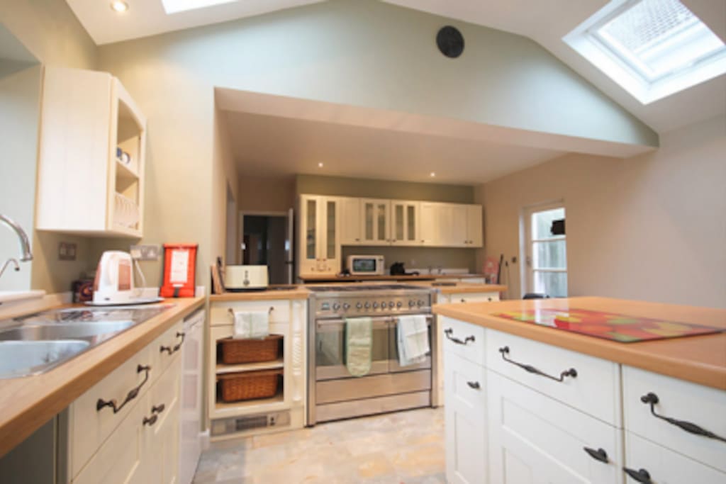 large kitchen diner with patio doors leading to private garden