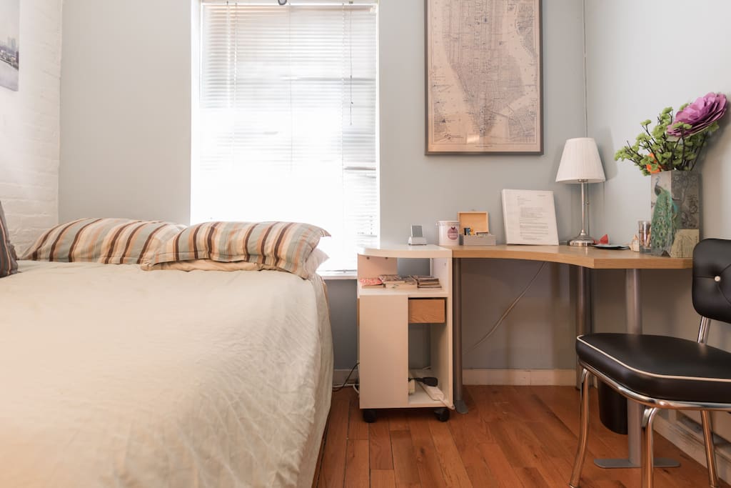 Guest bedroom: Full size bed, exposed brick and window