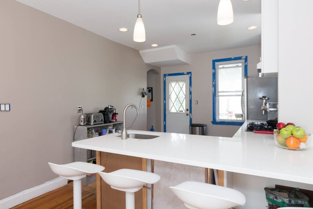 Newly-renovated open kitchen with bar seating, gas range, convection oven, dishwasher and more! All you need to cook and entertain!