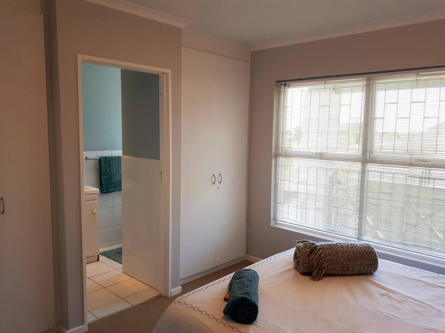 Main bedroom's private en-suite bathroom. With shower, toilet, heater and bathroom cabinet for storage for all your toiletry goodies.