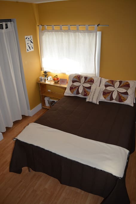 Your room with cozy double bed and walk-in closet.