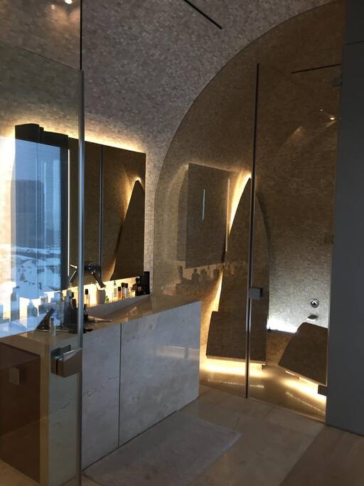 Bathroom with a steam cabin and a bathtub