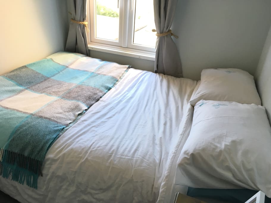 The double bed and window