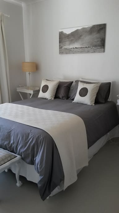 Bedroom with queen-size bed.