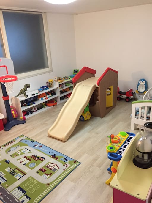 Our son's room--currently has a kids' single mattress on the floor...and a LOT of toys!