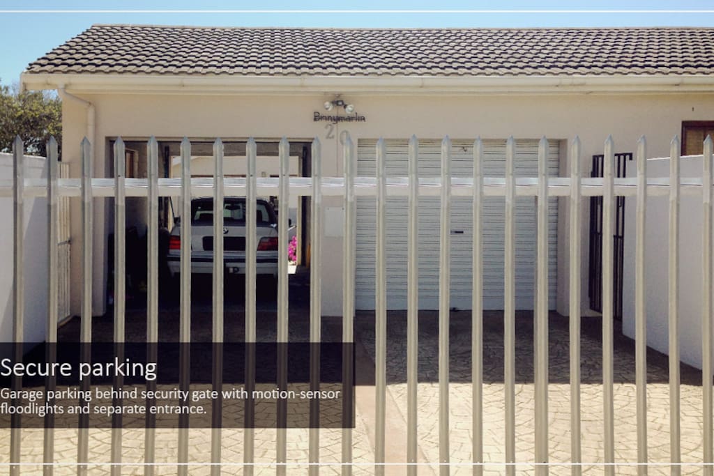 Secure parking. Garage parking behind security gate with motion-sensor floodlights and separate entrance.