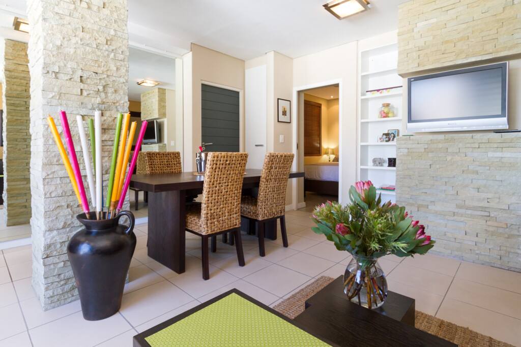 Open-plan living area with lounge and dining room.