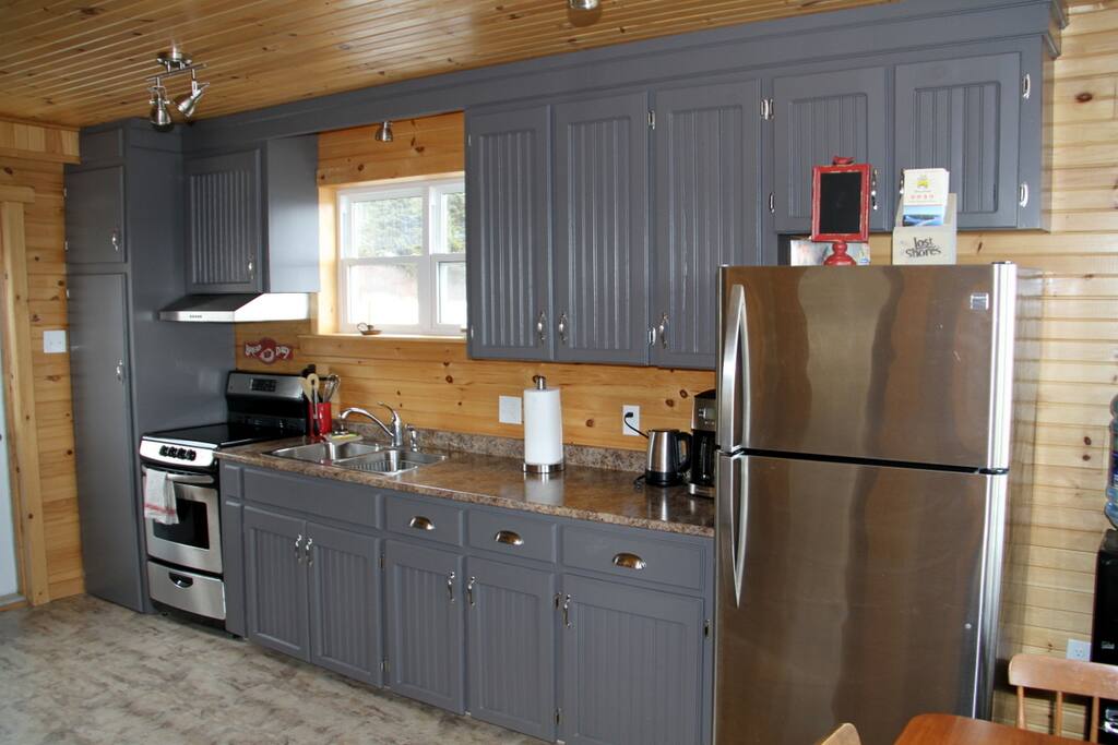 Cupboards are well stocked with everything you need.