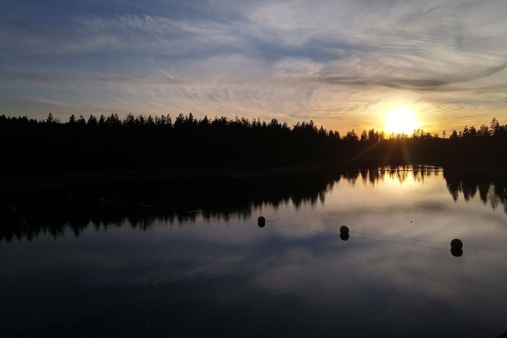Sunset over Spokane River looking off deck.