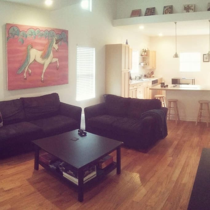 Living room looking into kitchen in background.