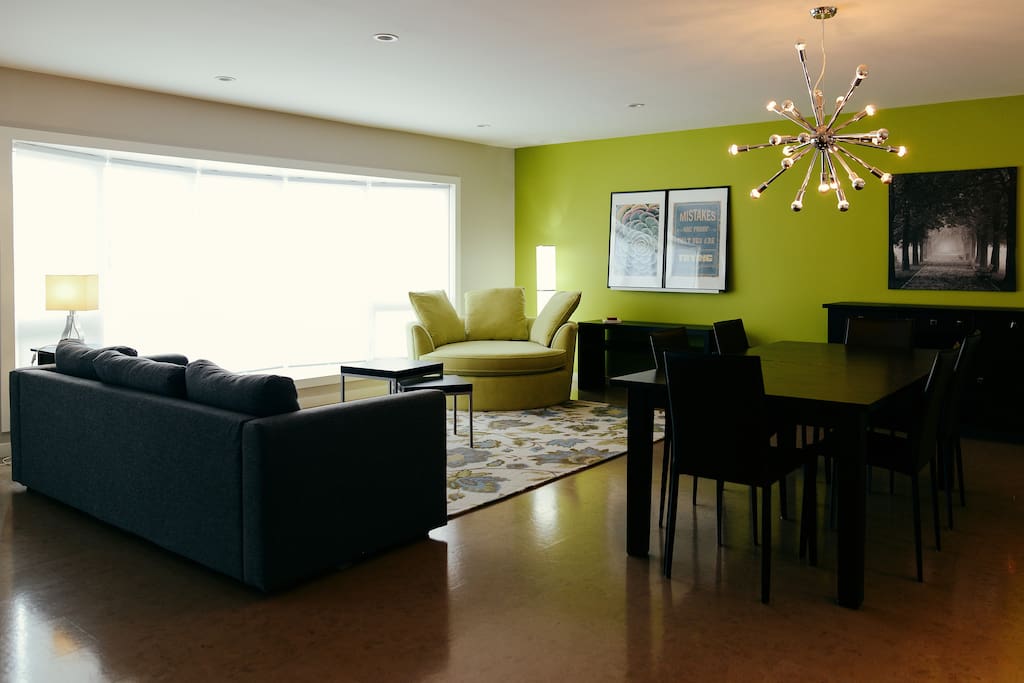 Modern and fun living room, to hang out and watch dinner get prepared in the custom kitchen