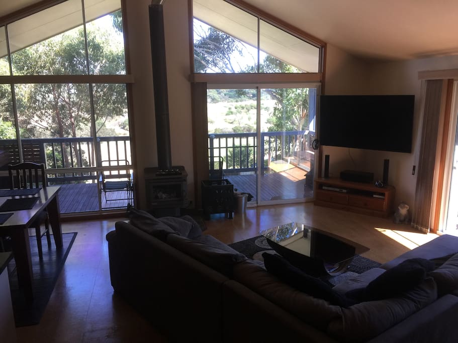 Spacious living area with large screen TV