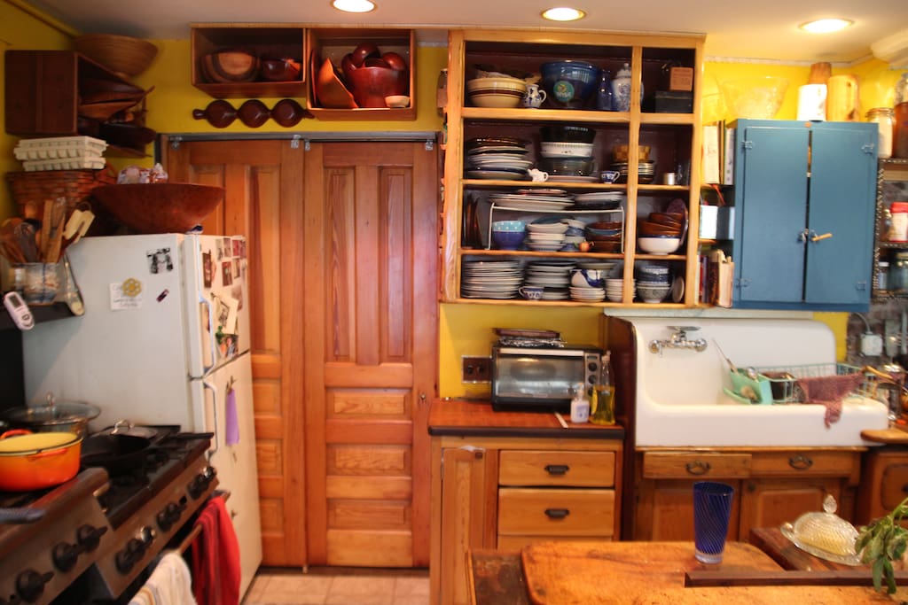 This listing--Double sliding Victorian doors lead from the kitchen into the twin bedroom.