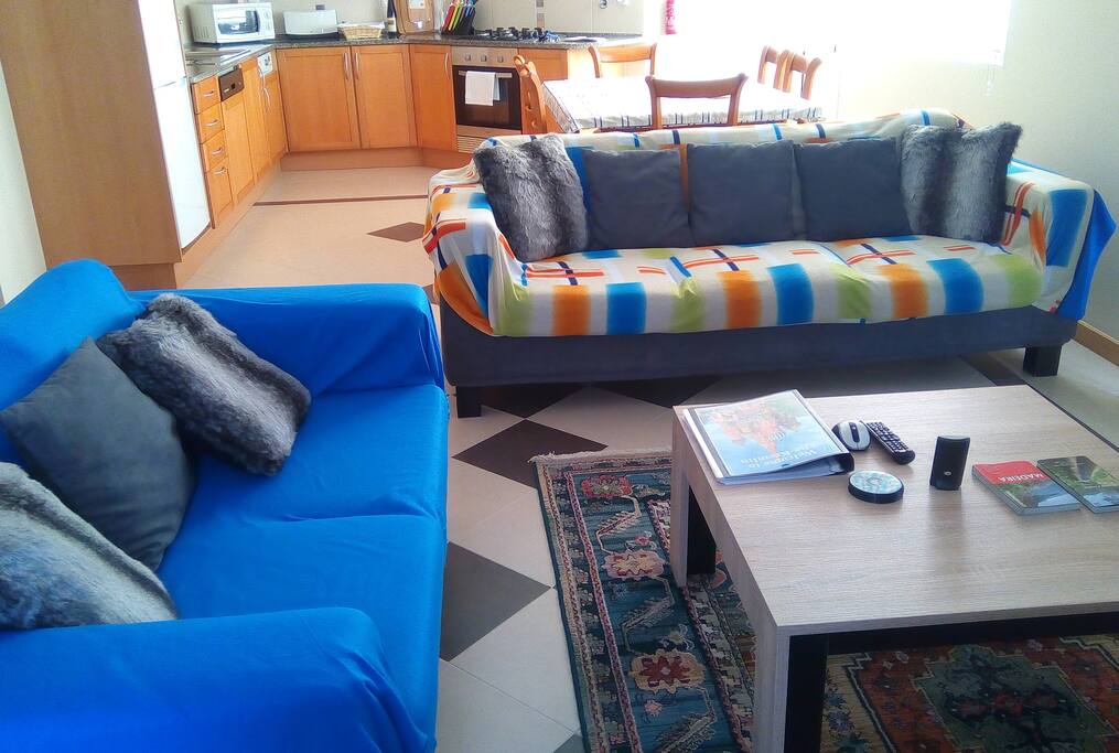 The living area with view toward the kitchen / diner.