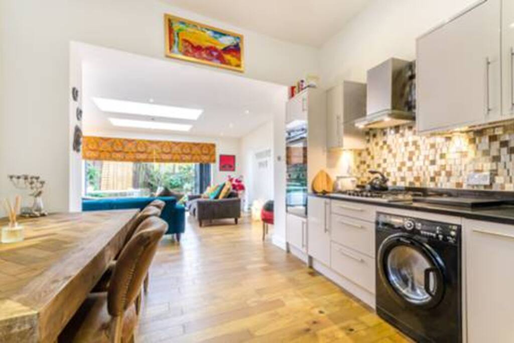 well equipped kitchen with washer dryer dishwasher two ovens and a lovely big dining table
