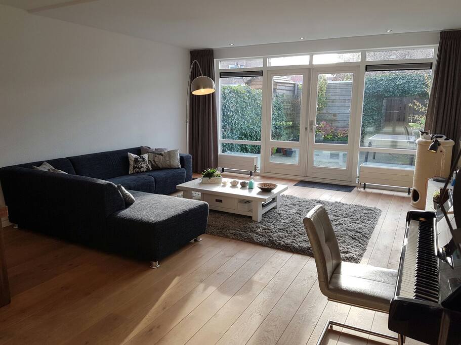 Big, spacious living room where you can sit and relax, watch some television or play some piano!