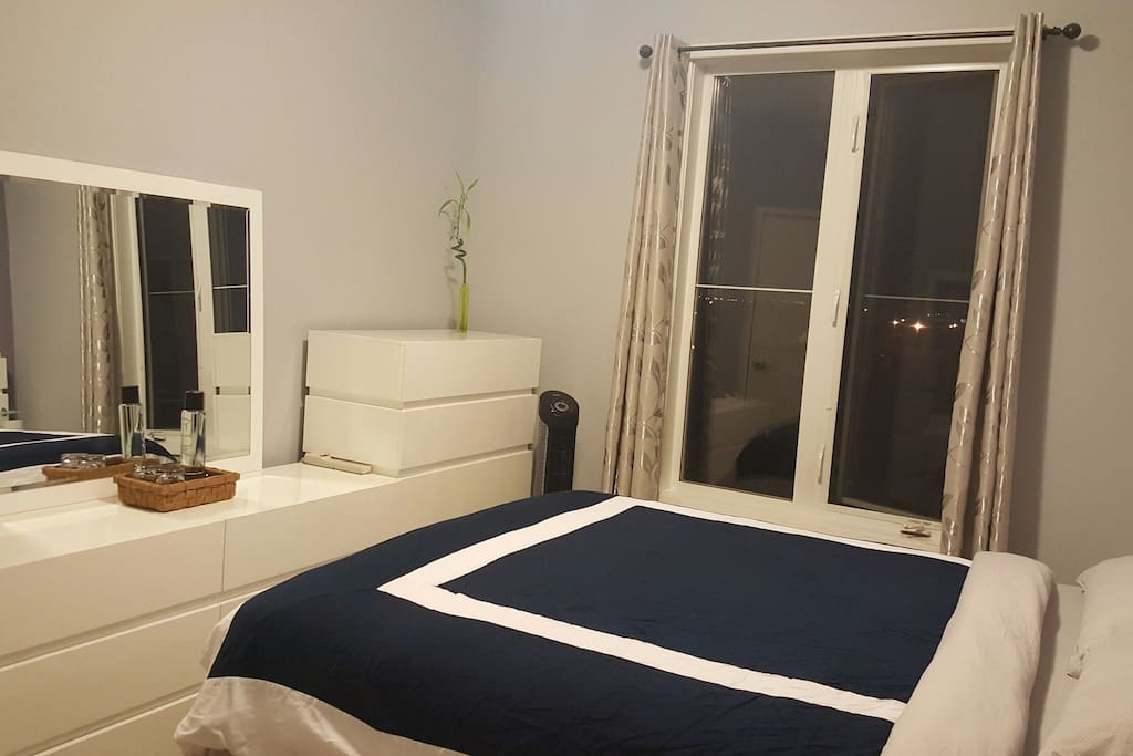 Your bedroom is equipped with dressers, a mirror, large size window, fan and extra luggage space in the closet
