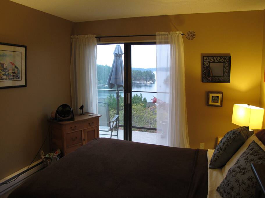 Bedroom opens onto deck that overlooks the water