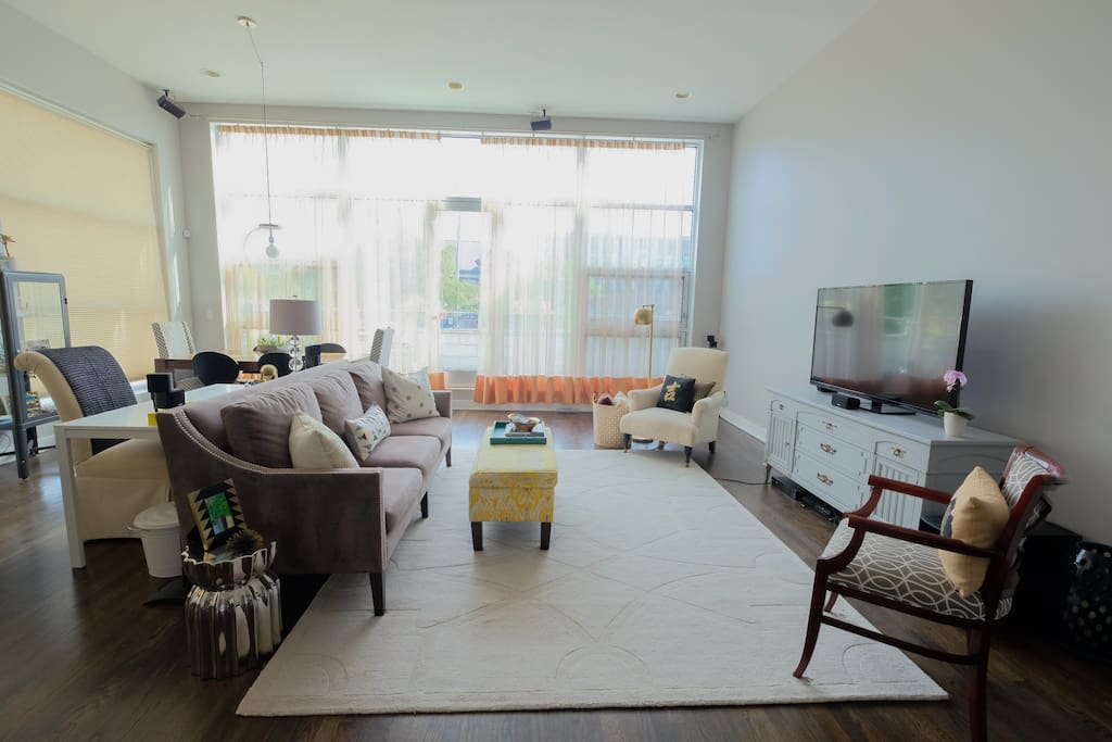 A 55" TV is equipped with cable and Netflix.
