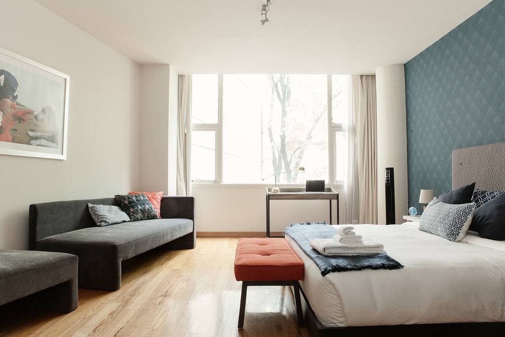 Comfortable king size bed. Bright and spacious bedroom.