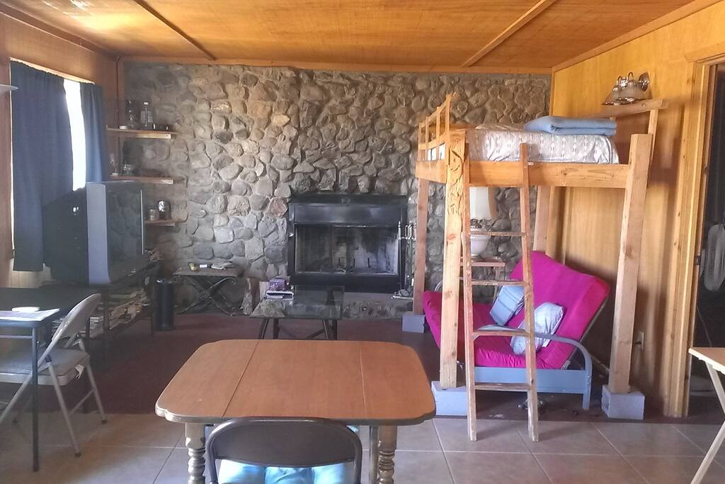 Dining area & living room with fireplace