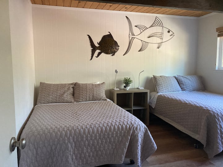 Bedroom #3
Floundering Fish Room with two double beds is perfect for friends to share and also makes a great kids room. This room includes a DVD/VHS player (Adult and Kid DVD and VHS tapes provided).