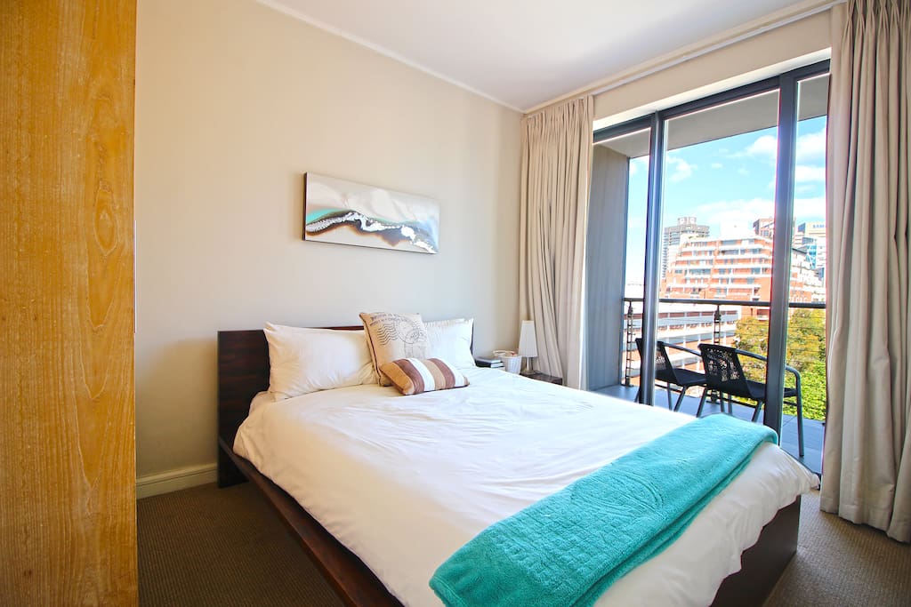One bedroom with comfortable queen bed, opening on to balcony with great views