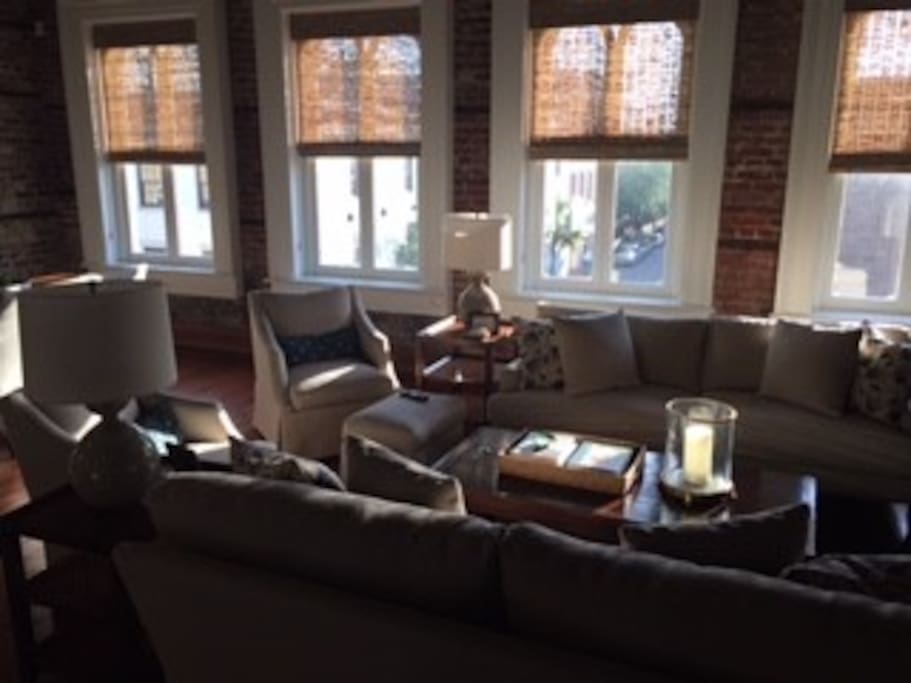 Open living area with big windows overlooking King St.