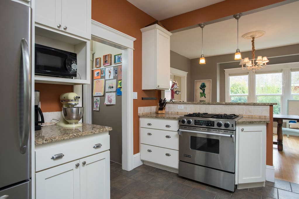 Large kitchen with ample cookware and a gas stove