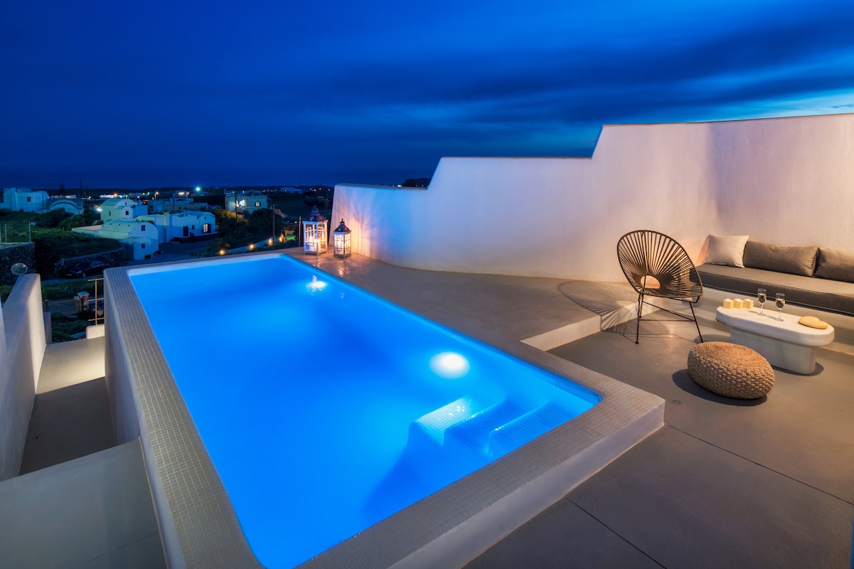 A tranquil private terrace is highlighted, featuring a plunge pool that glows under the evening sky. Nearby, a modern lounge area with comfortable seating provides ample space for relaxation, with soft lighting accentuating the serene atmosphere of the outdoor space.